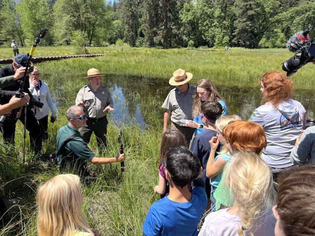 Group next to river. CDFW photo